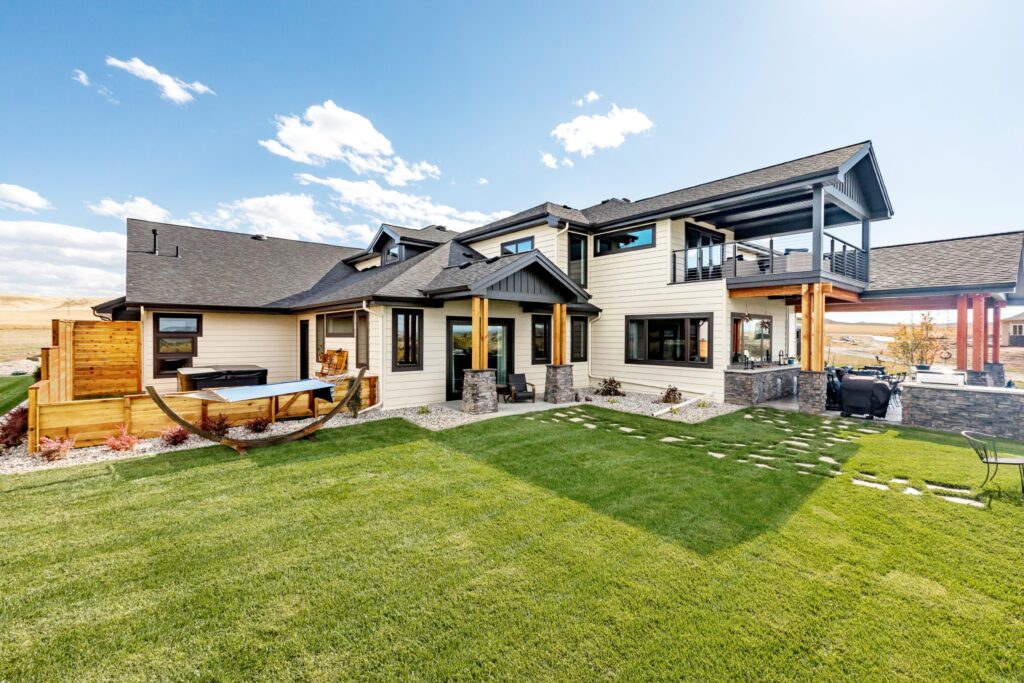 a modern house siding idea of mixed cream vinyl siding, wood, and black trim