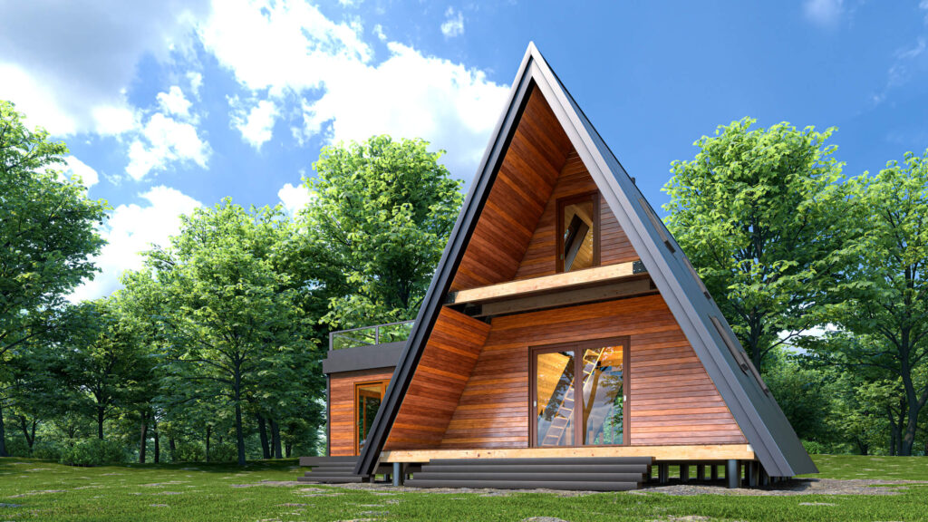 An A-Frame roof on a modern cabin-styled home in the woods